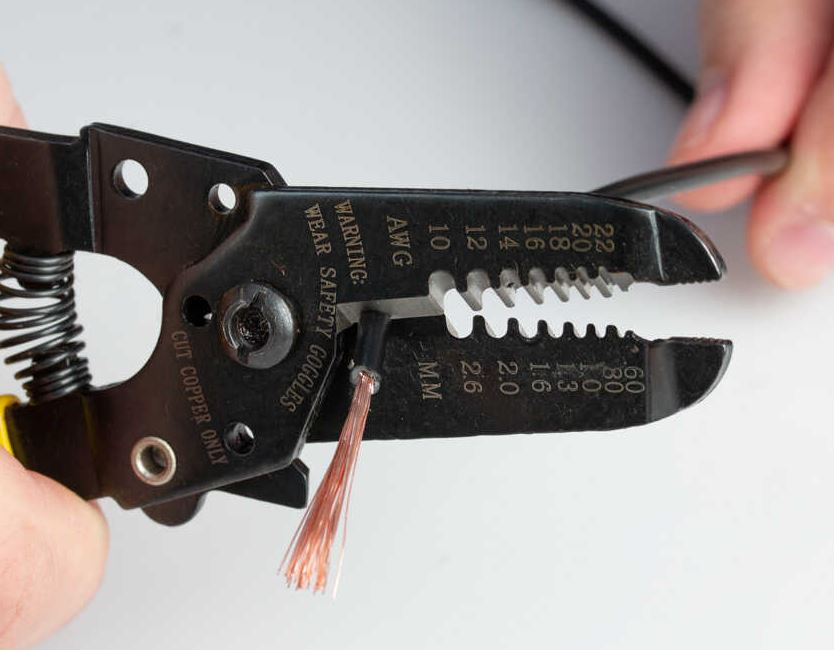 Wire stripper for an electrician